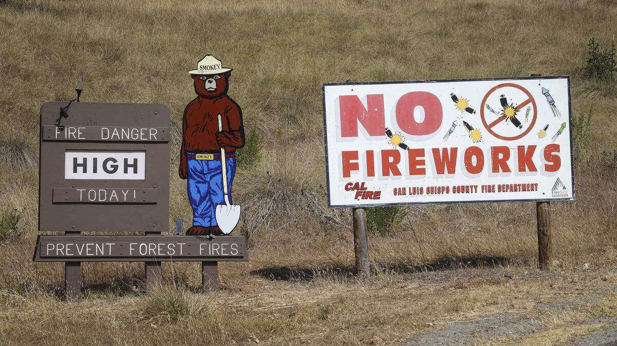 Lopez Lake campground was closed and evacuated, with a Smokey Bear sign warning of high fire danger, seen here on Aug. 8, 2025. As of the morning of the eighth day of the Gifford Fire, 3,431 firefighters were working in shifts on the 99,232-acre blaze.