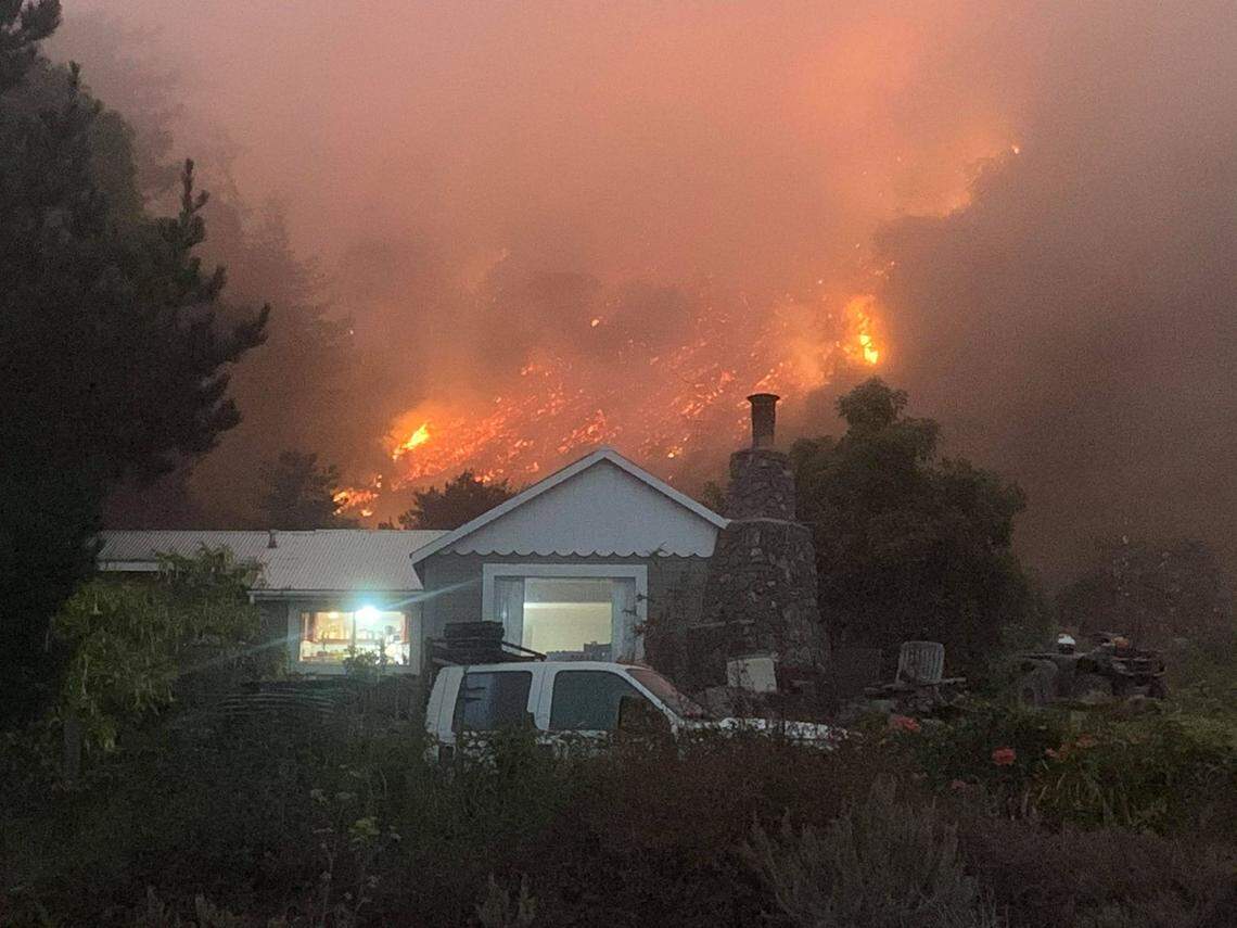 Backburning for the Dolan Fire around Rhea Withrow’s house brought the flames right down on the hillside behind her home.
