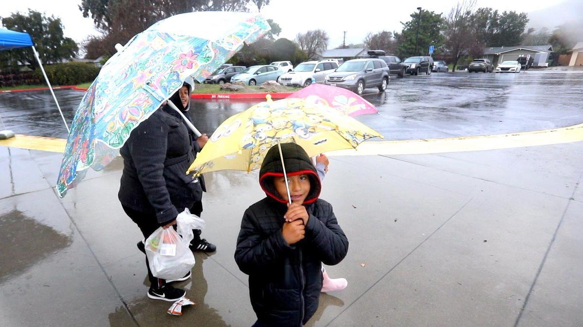 Leo Barajas picked up a meal with his brother and sister on Monday at C.L. Smith Elementary School in San Luis Obispo. Districts throughout the county are offering meal pickups for children as coronavirus closed schools.