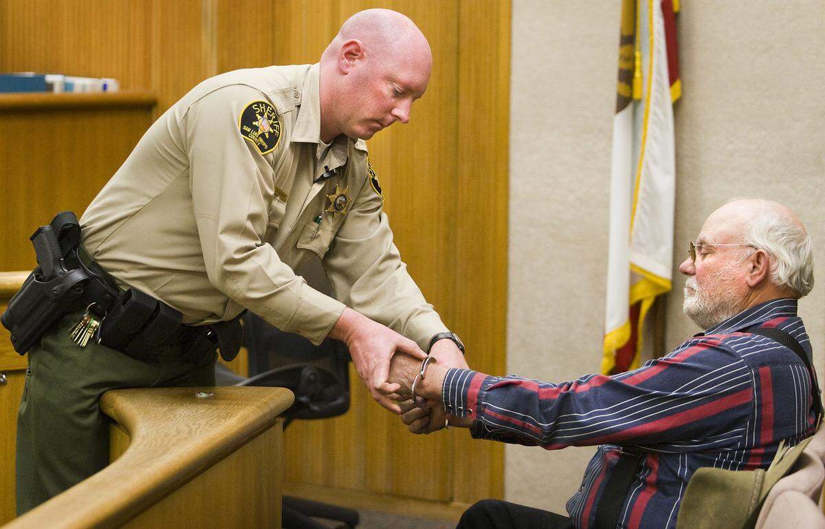 Dan DeVaul is handcuffed in a San Luis Obispo courtroom after refusing to agree to the judge's terms of probation.