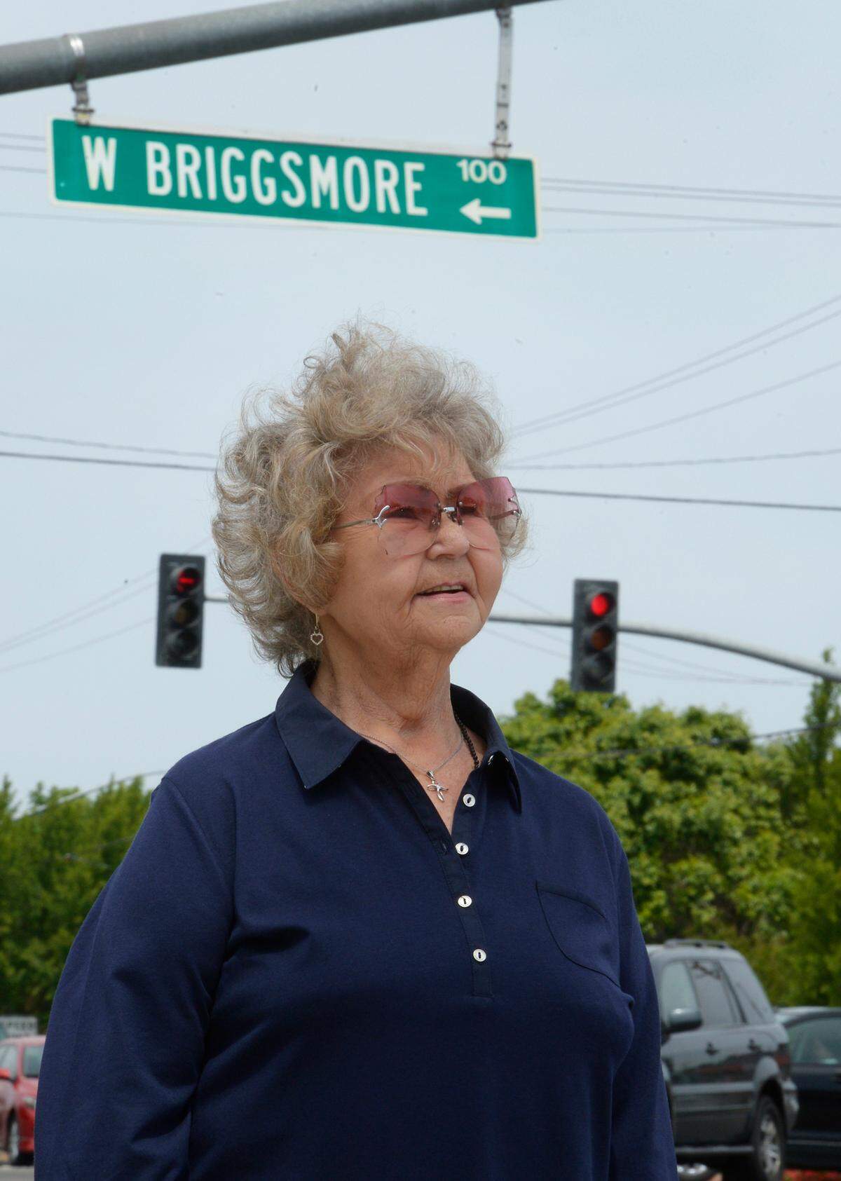 Elaine Ixcot, 76, of Modesto stands by the busy intersection of Briggsmore and McHenry avenues in Modesto in 2014. Her aunt and uncle, Rose and Russell Briggs, lived on the northwest corner of those streets.