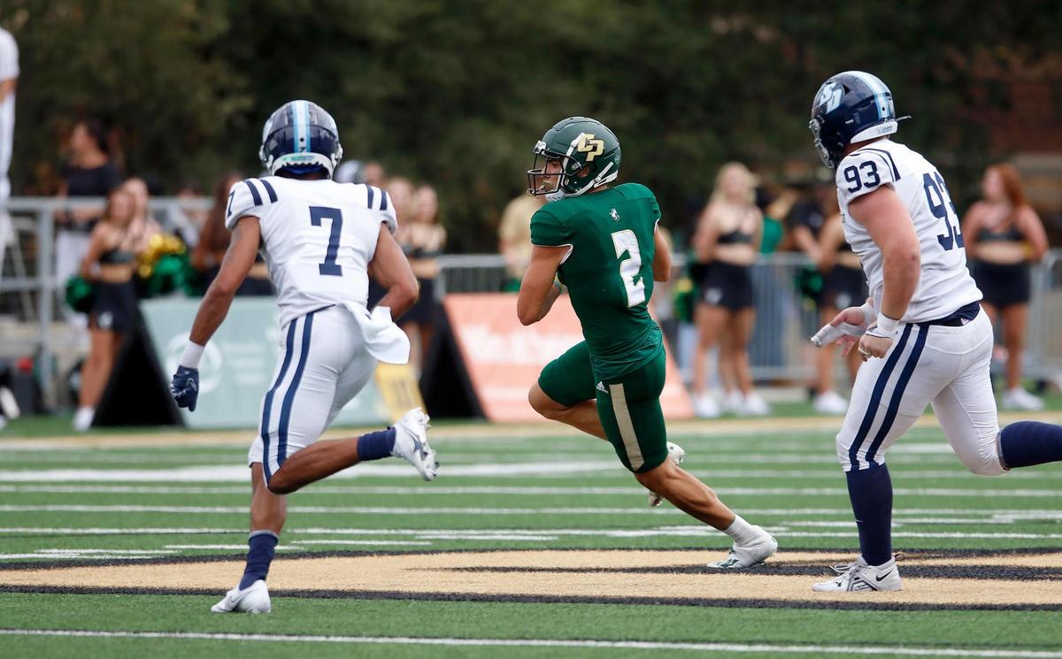 Cal Poly wide receiver Giancarlo Woods (2) runs after catching a pass in the Mustangs’ 28-27 comeback win over the University of San Diego at Alex G. Spanos Stadium in San Luis Obispo on Saturday, Sept. 10, 2022.