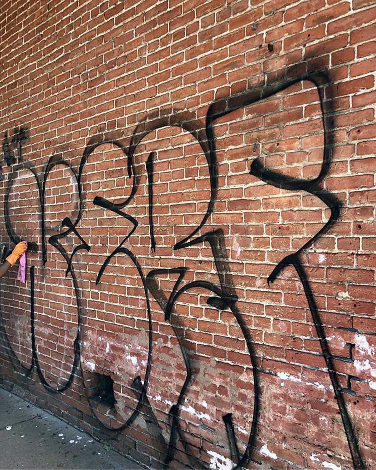 The vandalized wall at the Ah Louis Store, Aug. 30, 2018.