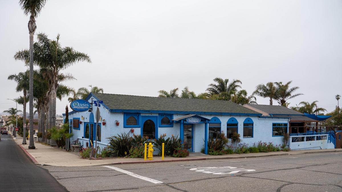 The century-old restaurant building currently occupied by Oasis Moroccan Restaurant along with an old gas station and 10 houses near the intersection of Price and Dolliver streets in Pismo Beach, California, are slated for demolition as part of a new mixed-use “gateway” project from developer Coastal Community Builders, pictured here Wednesday, June 4, 2025.