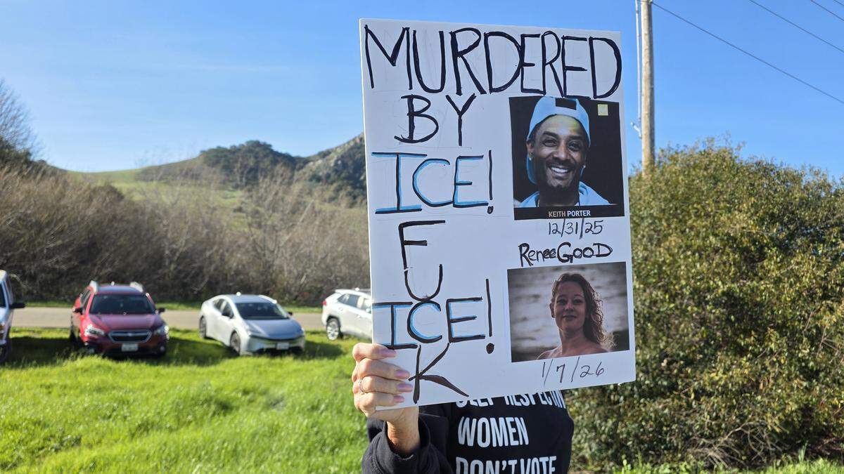 More than 250 people gathered at Highway 1 and Kansas Avenue to protest ICE in San Luis Obispo on Jan. 11, 2026.