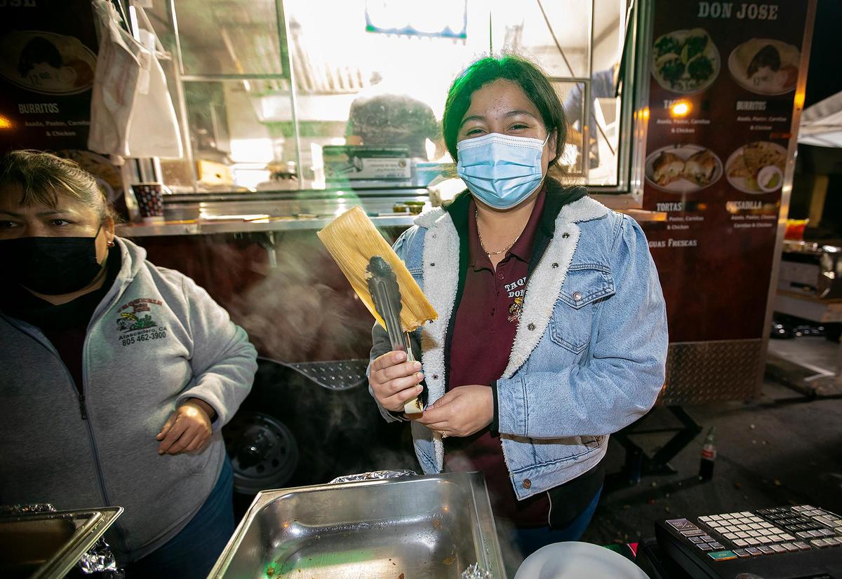 Diana Rodriguez of Taqueria Don Jose serves chicken and cheese/jalapeño tamales with her mom, Veronica Rodriguez, left, at the sixth annual Tamale Festival in Atascadero on Jan. 15, 2022. Taqueria Don Jose is a family-run business in Atascadero.