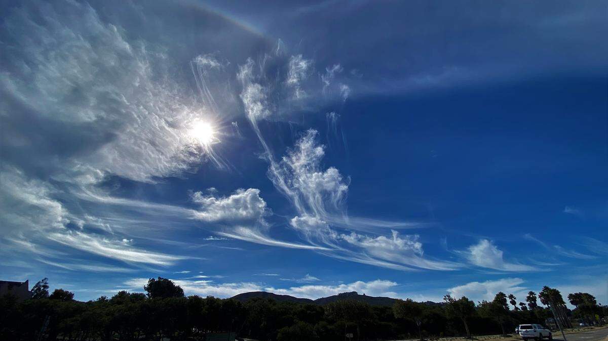 Altocumulus Castelanus, or jellyfish clouds, and high-level cirrus clouds hang above Los Osos.