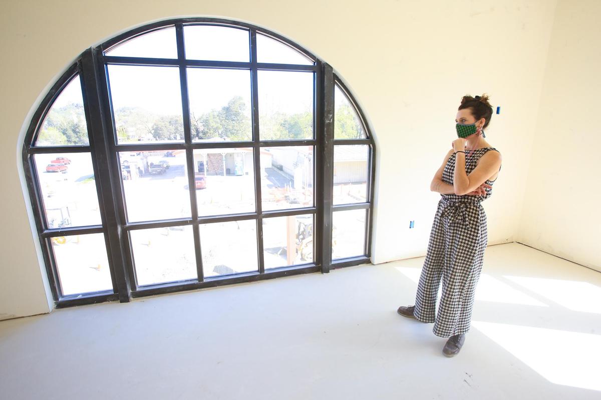 Zoe Zappas gives a tour of a spacious master suite in one of the luxury apartments at the new La Plaza development in Atascadero. The three-story project will have commercial on the ground floor and residential units on the upper floors.