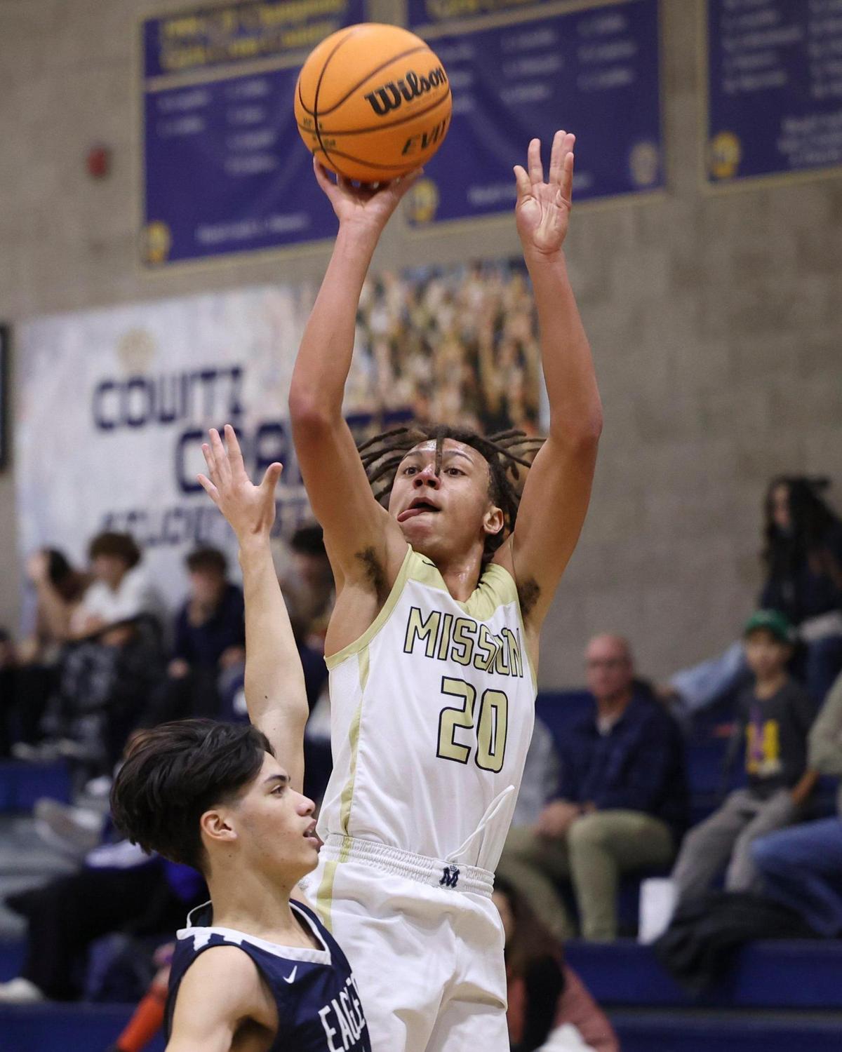 Jayden Nozil shoots over Zach Soriano as Arroyo Grande boys basketball beat Mission Prep 50-44 on Jan. 12, 2024.