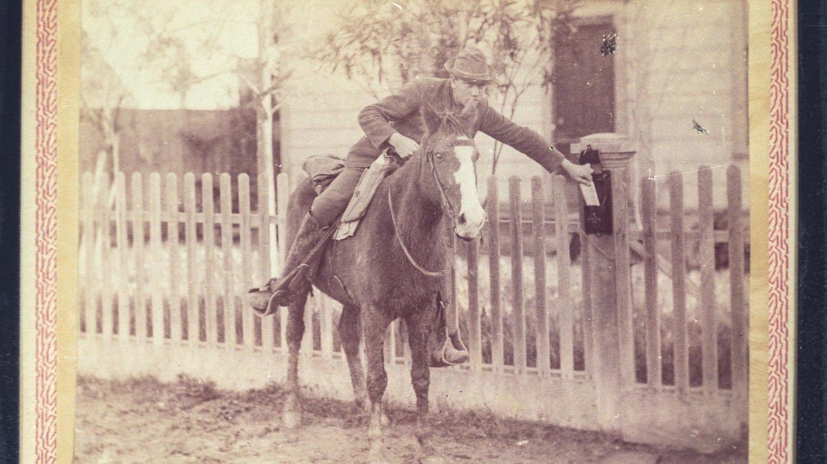 Ed Carpenter delivers The Tribune on horseback in a photo gifted to newspaper subscribers on Jan. 1, 1890.