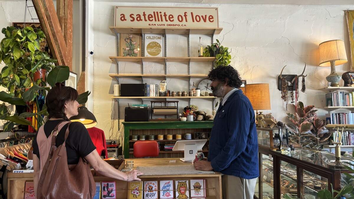 A Satellite of Love owner Malik Thorne speaks with a customer at his vintage shop’s new location at 1235 Monterey St. in San Luis Obispo, seen here on June 6, 2026.