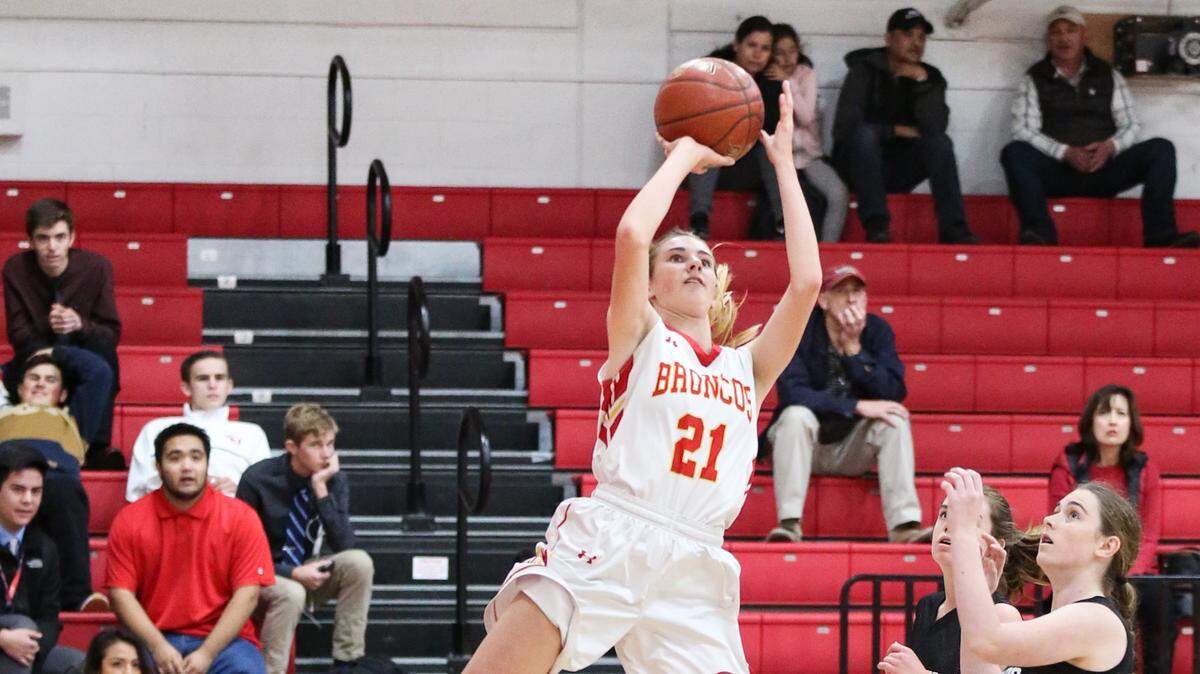 Senior Karis Lawson scored 14 points and dished out eight assists in Coast Union’s win over Dunn School on Jan. 25. Here she goes up for a layup earlier in the season.