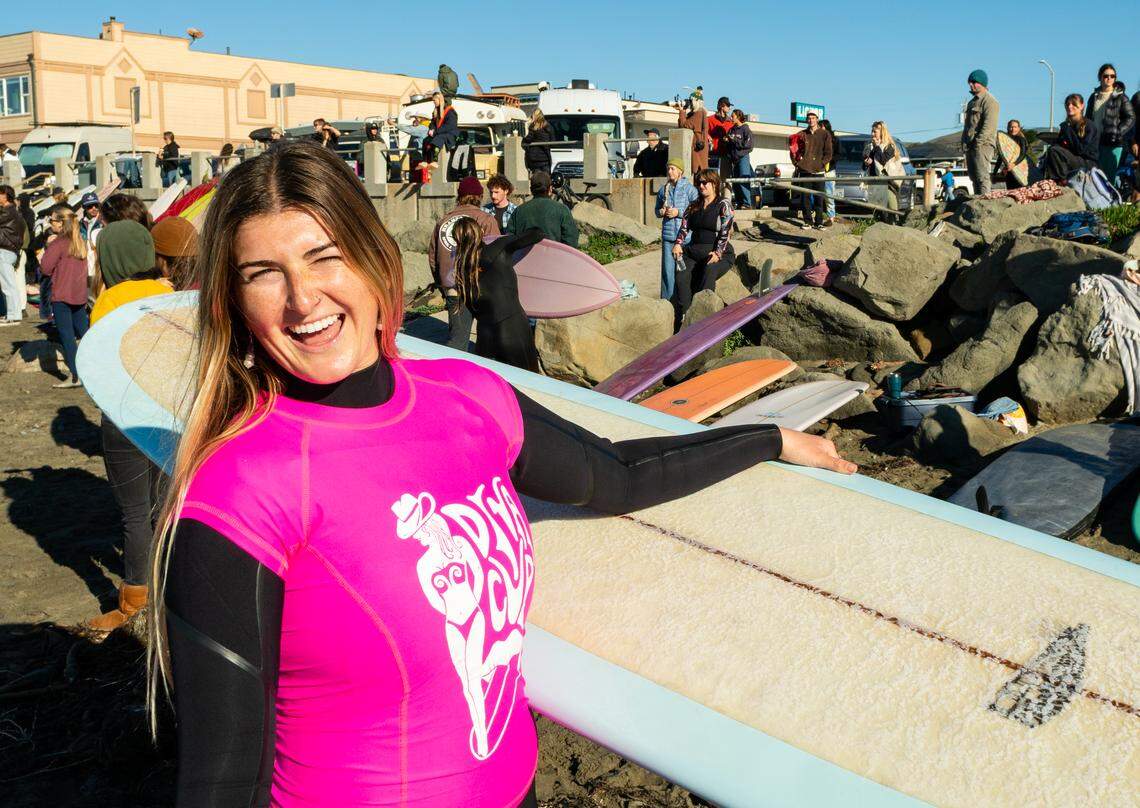 A surfer prepares to compete in the third annual Diva Cup Surf Invitational, San Luis Obispo County’s only woman’s surf competition, in Cayucos on Nov. 22, 2025.