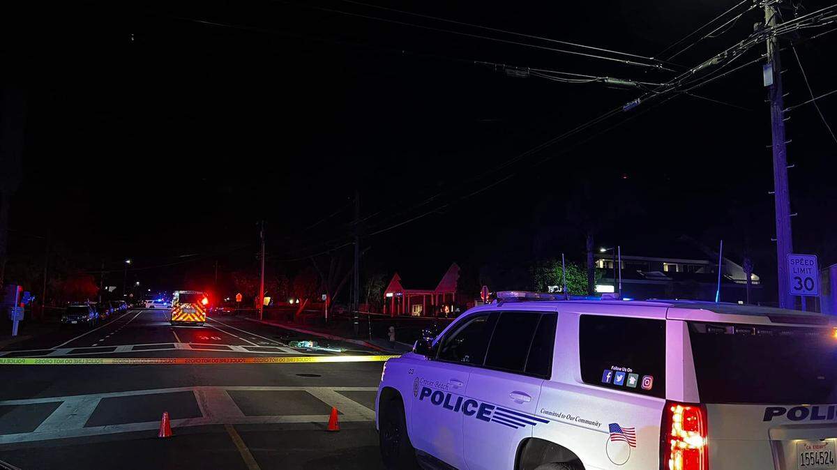 Police blocking off traffic near a fatal collision between a bicyclist and fire truck in Grover Beach, California, on July 27.
