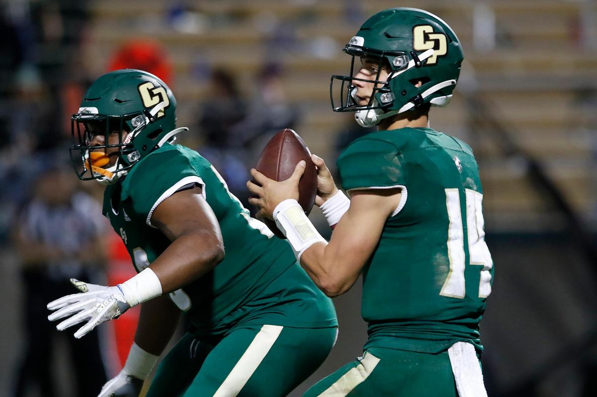 Cal Poly quarterback Jackson Pavitt (14) looks to pass during the Mustangs’ 38-7 loss Weber State at Alex G. Spanos Stadium, Saturday, Oct. 2, 2021.