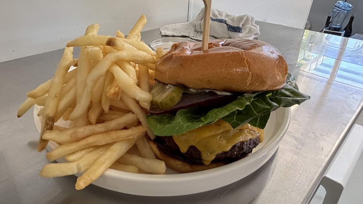 The wagyu burger at Melo Mela Kitchen comes with seasoned fries, seen here on June 25, 2026.