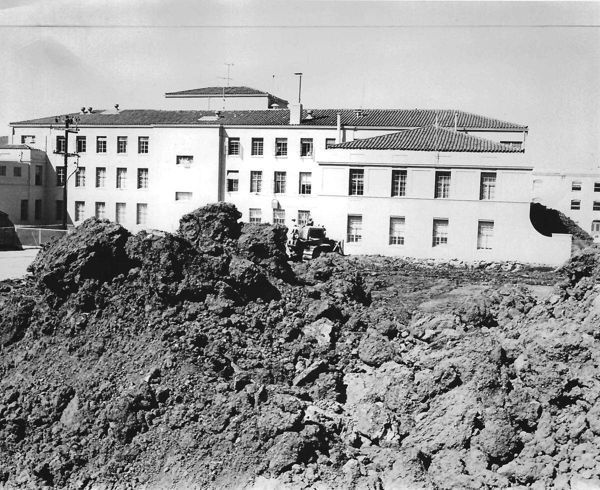 The Maino Construction company works on the $1 million San Luis Obispo County Courthouse Annex in June 1963. This view, from Palm Street, shows earth-moving operations prior to construction. The $1 million mid-century modern building on Palm Street was designed by John Badgley and opened in July 1964.