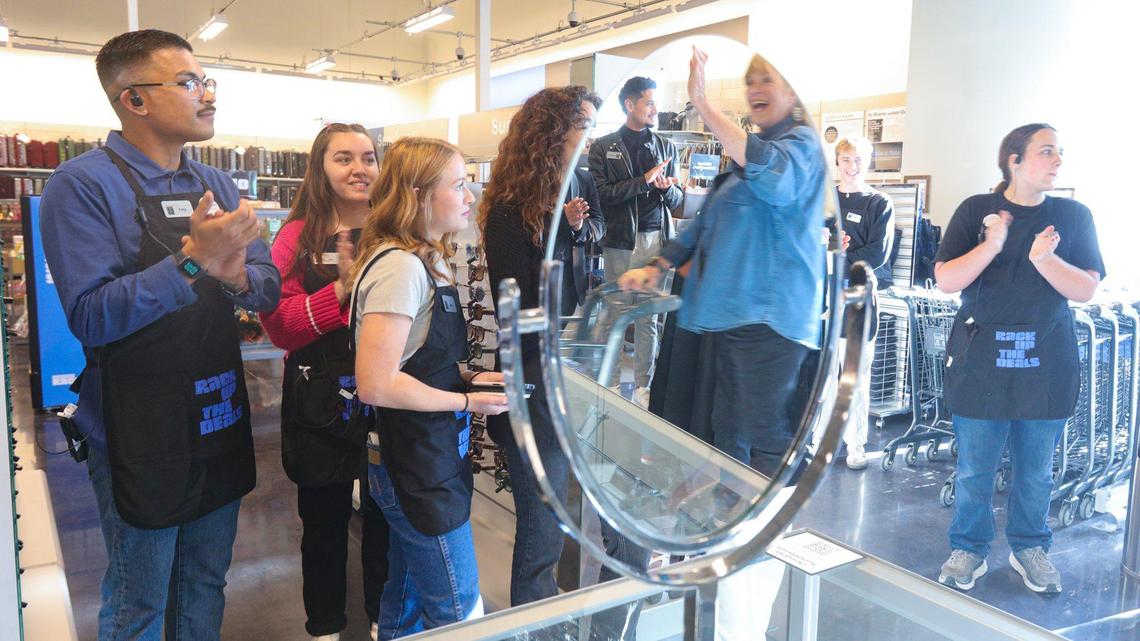 Employees clap and cheer while welcoming customers to an invitation-only event at the new Nordstrom Rack store at the SLO Promenade on Oct. 24, 2023.