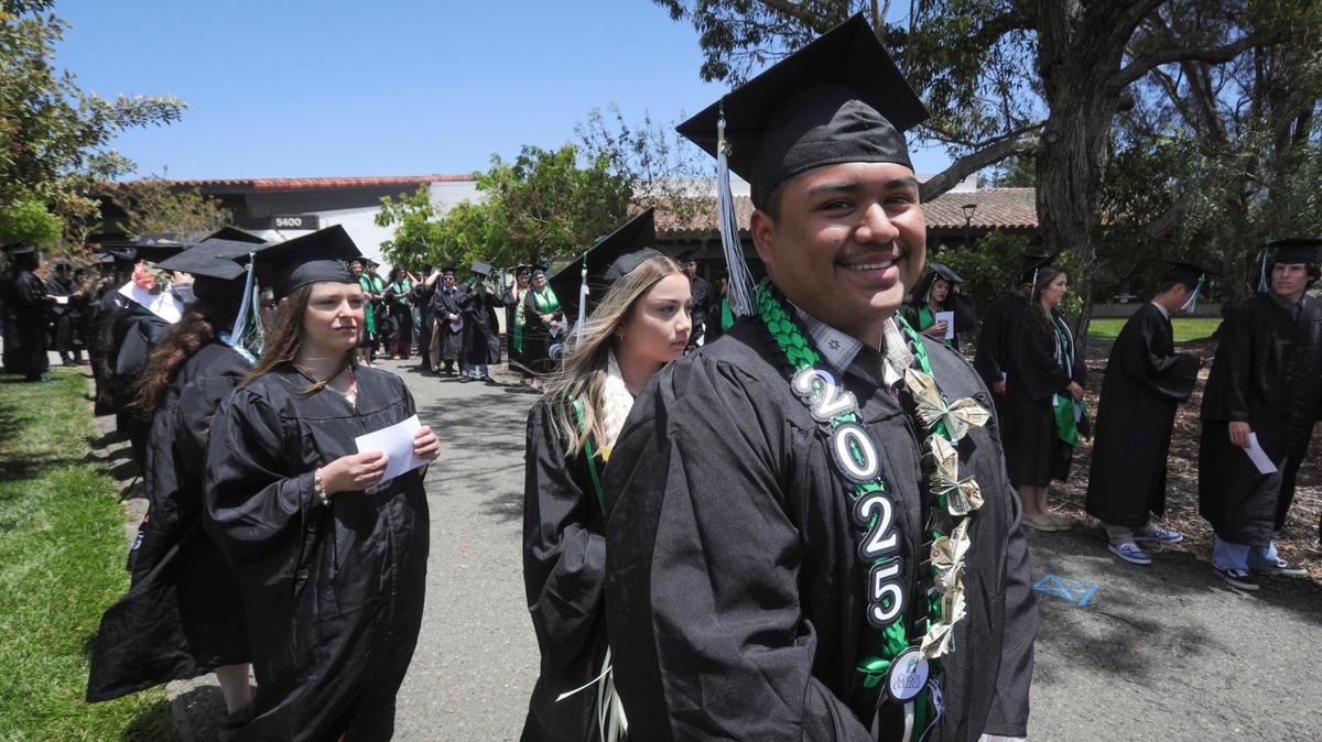 Jaime Perraza waits for the band to play for the group to walk in. Cuesta College celebrated its 60th Commencement Ceremony on campus May 23, 2025.
