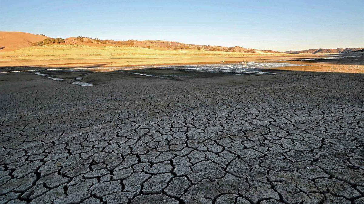 The growing drought exposes a parched lakebed at Lake San Antonio.