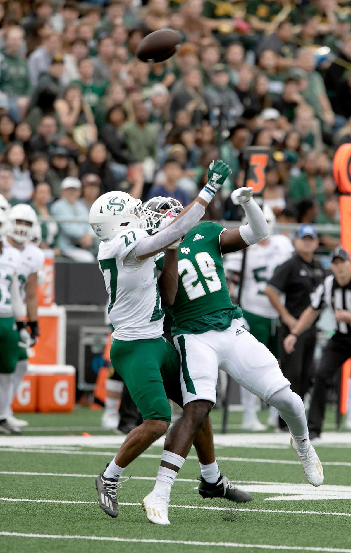 Cal Poly’s Tyrece Fairly-Diyem (29) and Sacramento State Gavin Davis-Smith (27) battle for the football in the Mustangs’ 49-21 loss to Sacramento State at Alex G. Spanos Stadium on Saturday, Oct. 1, 2022.