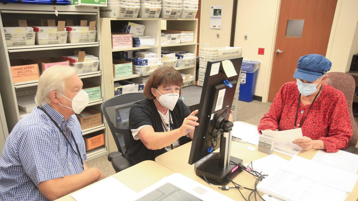 A team of three people – from left, Dan Pittaway, Ann Tapper and AmySue Caperton – duplicates ballots that cannot be processed due to rips, stains or identifying marks. The process requires a reader, marker and checker. The process of organizing the over 117,000 ballots received by San Luis Obispo County proceeded Monday at the San Luis Obispo County Government Center.