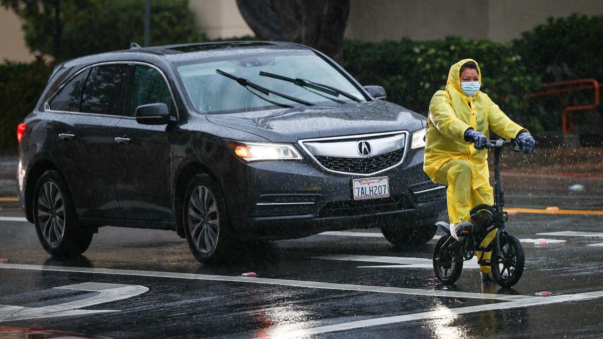 A cyclist waits for a traffic light to change near the San Luis Obispo County courthouse at the corner of Monterey and Santa Rosa streets on Tuesday, March 14, 2023.