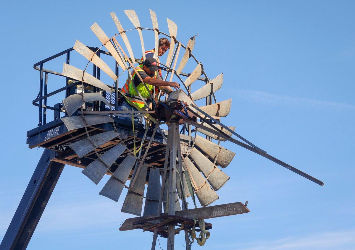Workers were dismantling the windmill as part of the development effort on the former Bonetti Ranch at the corner of South Higuera and Tank Farm Road on Dec. 1, 2017.