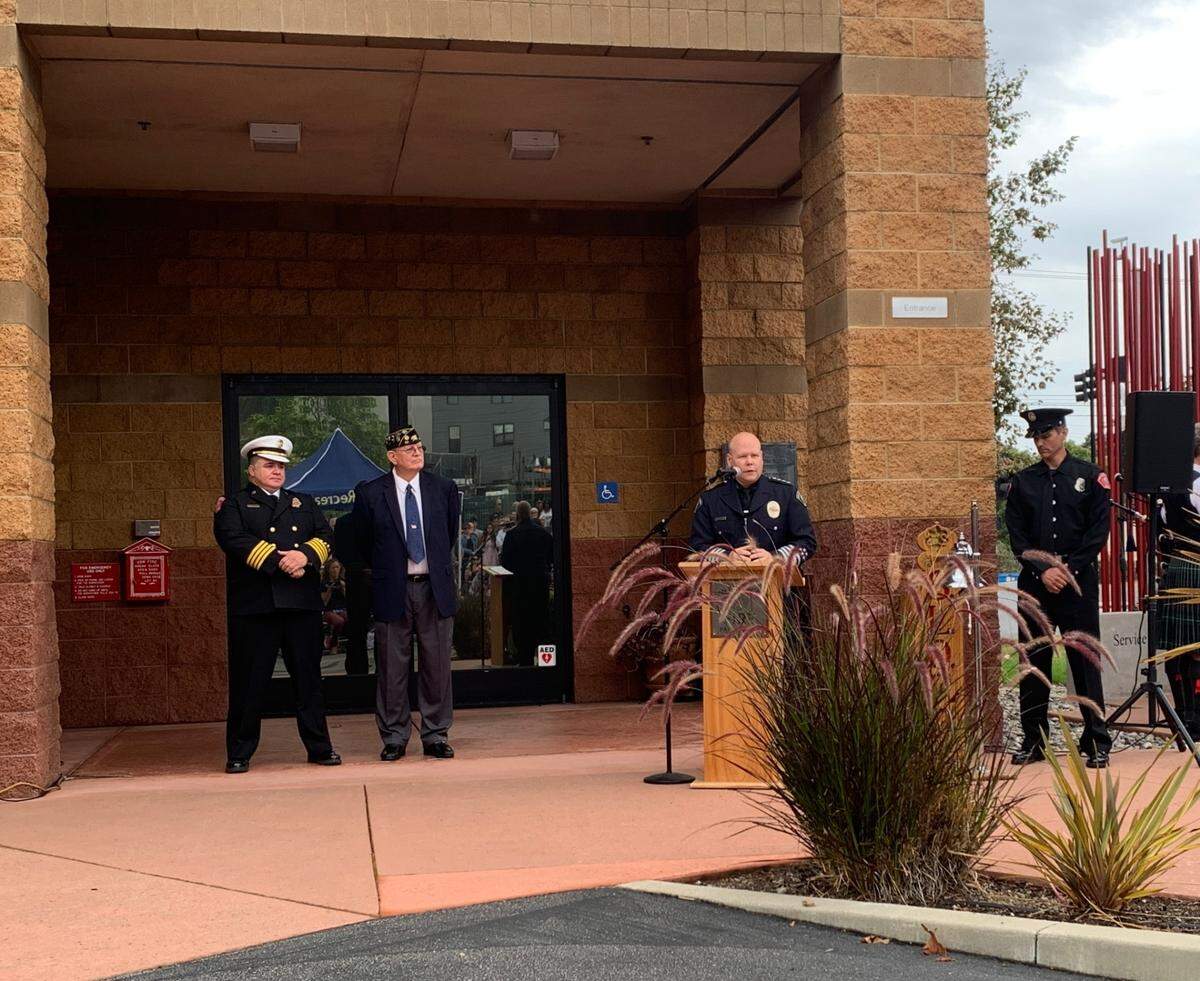 San Luis Obispo Police Chief Rick Scott, second from right, speaks at the 9/11 Day of Remembrance ceremony at the World Trade Center Memorial in front of Fire Station No. 1 in San Luis Obispo on Sunday, Sept. 11, 2022. 