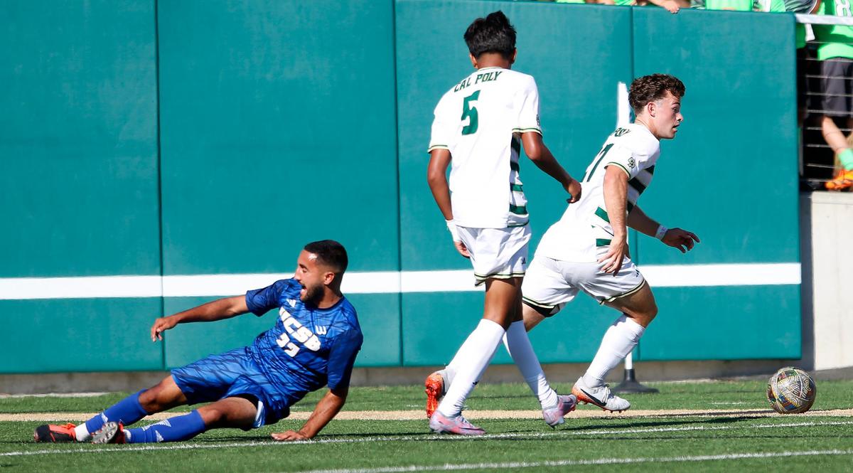 Cal Poly’s Nico Baltazar and Jack Muoio dribble the ball away from UC Santa Barbara player. Cal Poly beat UCSB 2-0 in the annual Blue-Green Rivalry soccer game on Sept. 28, 2024.
