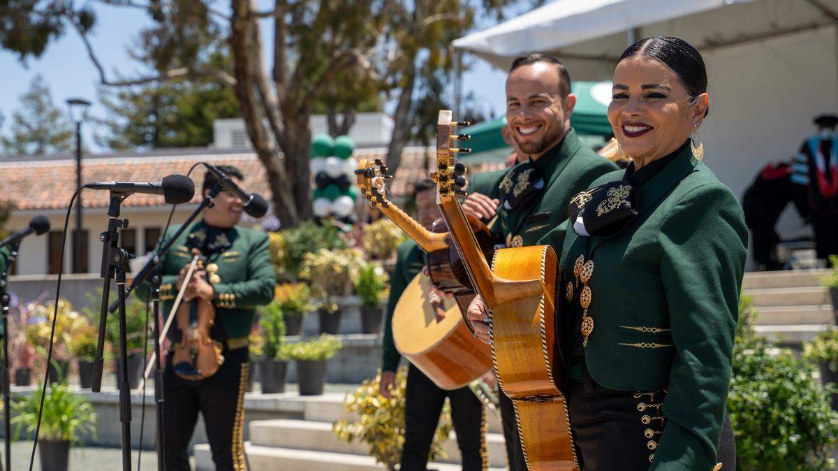 Mariachi band players share a smile between songs at the 61st Commencement at Cuesta College on Friday, May 22, 2026. More than 1,500 students walked the stage on Friday.