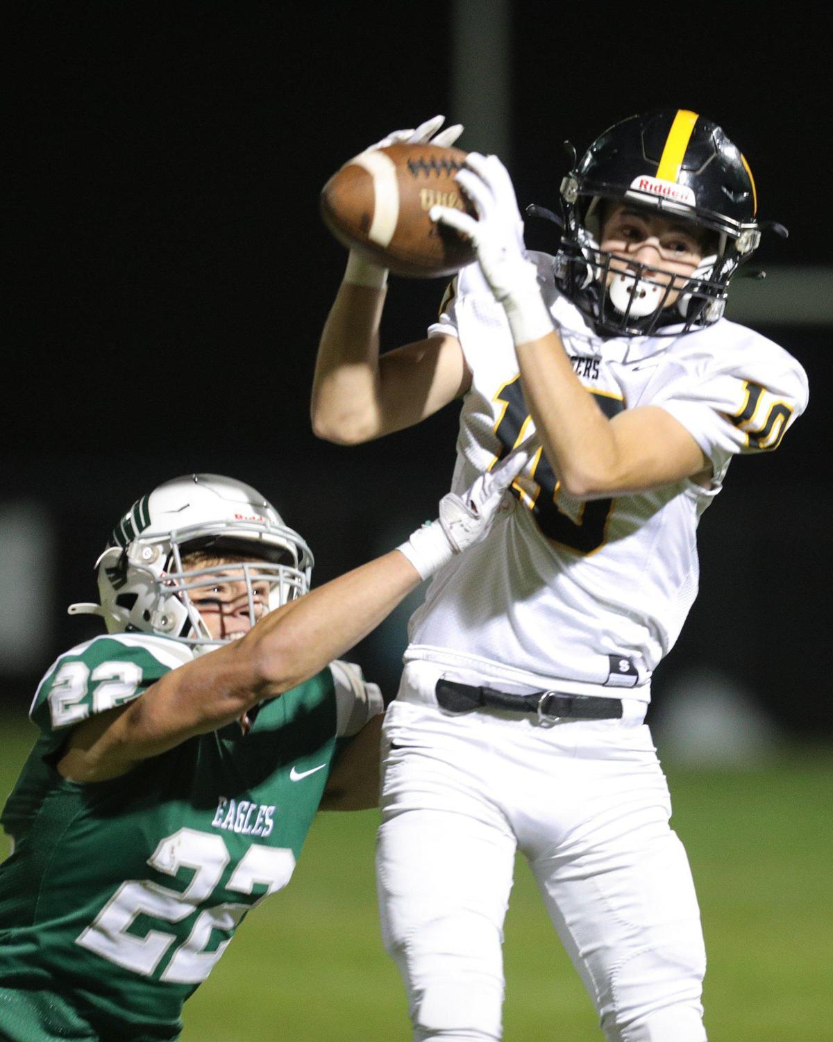 Finnigan Hickey makes a catch as Jaron Sampson defends in San Luis Obispo’s 17-14 win over Templeton on Oct. 27, 2023, in the last game of the Ocean League’s regular football season.
