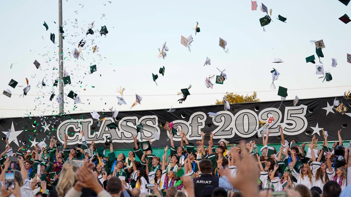The Templeton High School Class of 2025 throw their graduation caps in the air at the conclusion of commencement ceremonies at Volunteer Stadium on Thursday, June 5, 2025.