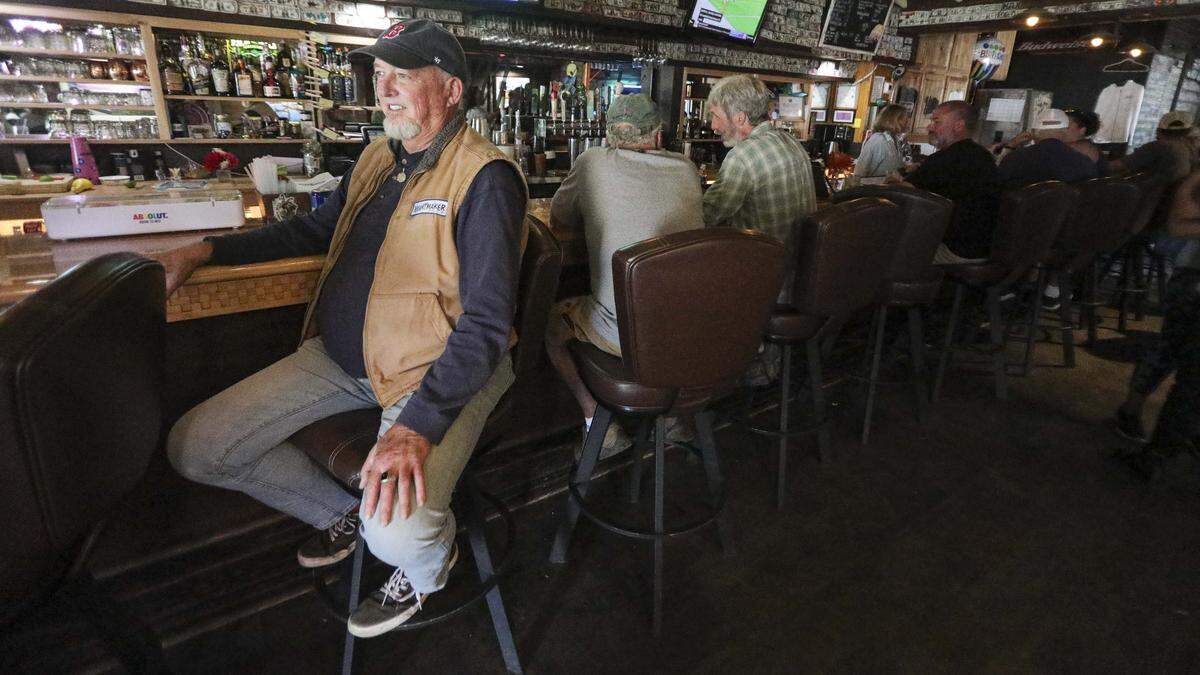 Tony Stron sits at Niffy's Merrimaker in Baywood-Los Osos. His son is one of the bartending staff seen here on Aug. 18, 2025.