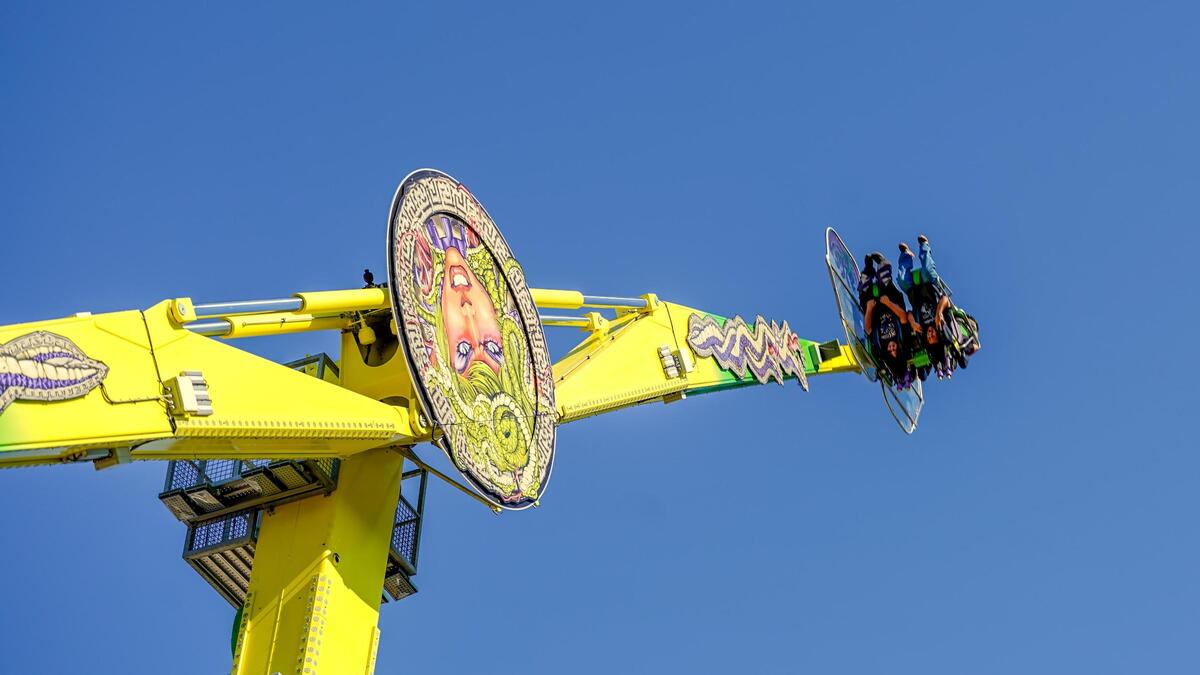 Fairgoers ride “Medusa,” a spinning ride at the California Mid-State Fair on Wednesday, July 16, 2025. The Mid-State Fair will run from July 16-27.