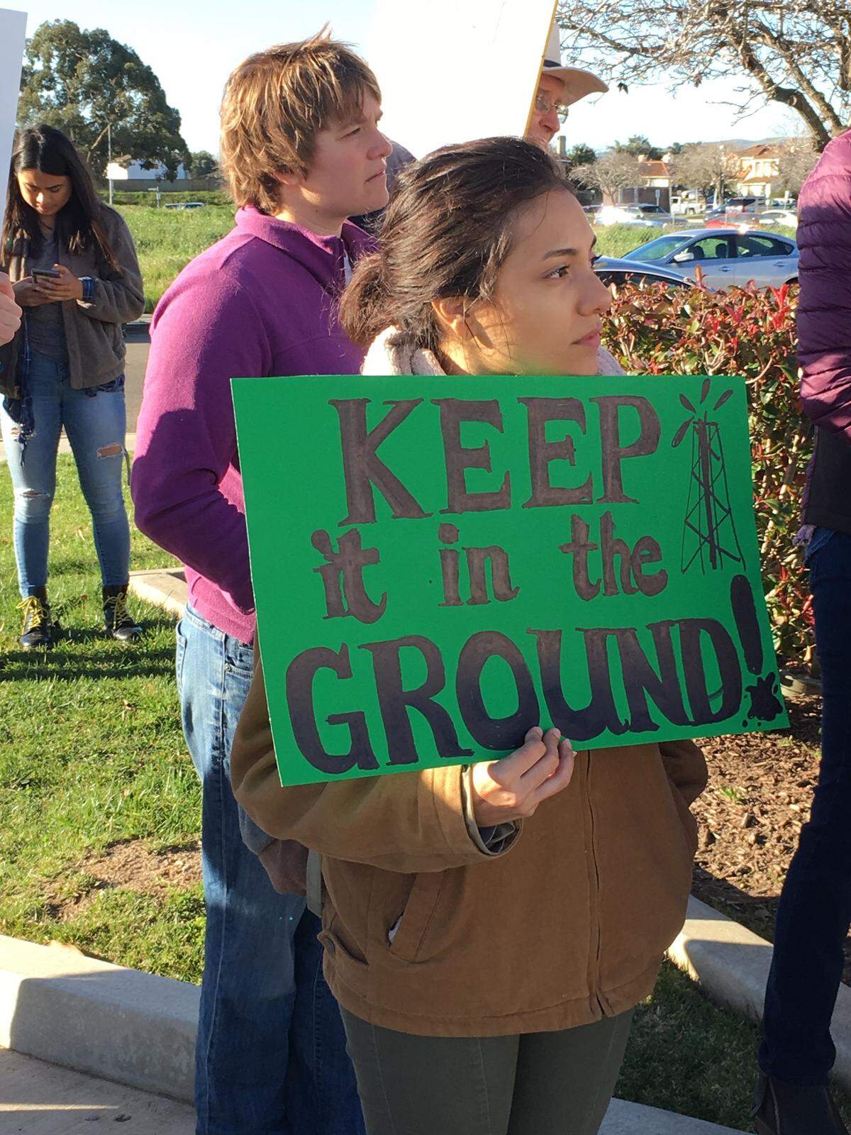 Protesters gathered before a Santa Barbara County Planning Commission meeting calling on officials to reject new oil wells in Cat Canyon.