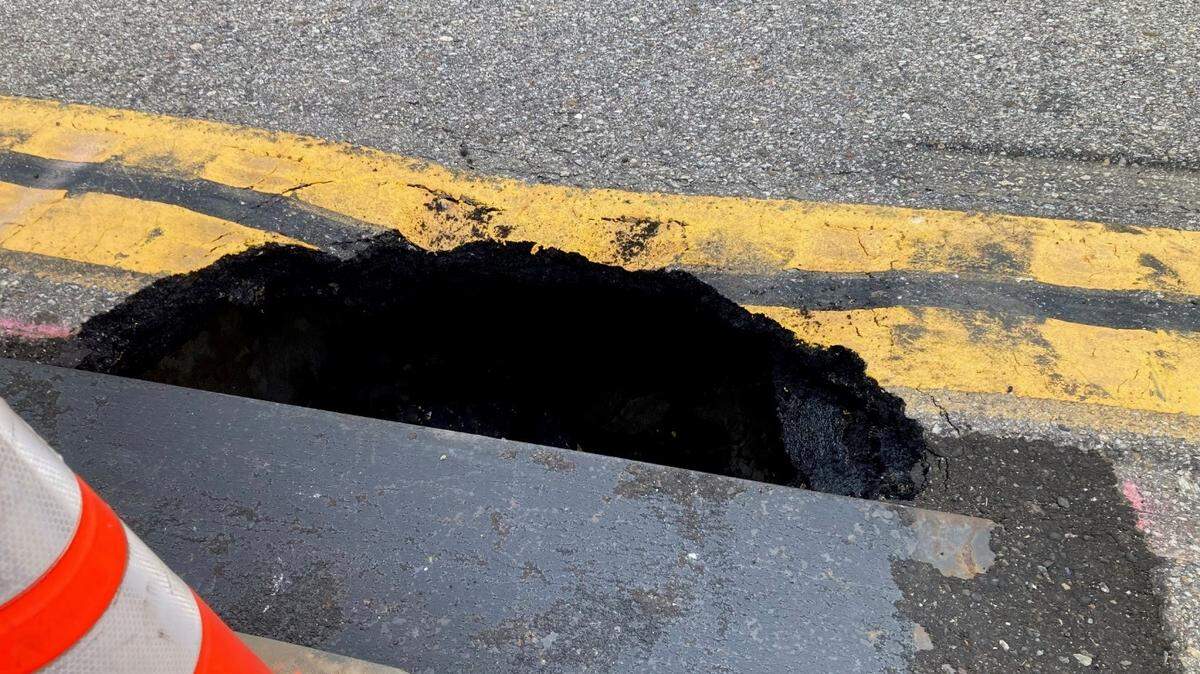 This sinkhole on Highway 1 south of Nacimiento-Fergusson Road is seen on July 2, 2023.