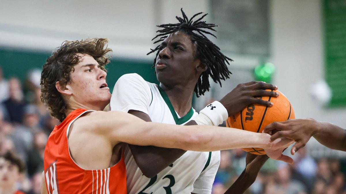 Mason Degnan defends as Trevon Carter-Givens goes to the basket. In a close game, Templeton High School pulled away in the final minutes, beating Atascadero in a boys basketball game on Feb. 6, 2024. Carter-Givens is The Tribune’s SLO County Player of the Year for the 2023-24 season.
