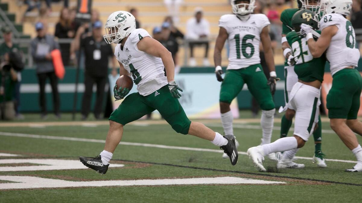 Sacramento State running back Cameron Skattebo (4) jogs into the end zone for a touchdown at Alex G. Spanos Stadium on Saturday, Oct. 1, 2022, at Cal Poly. The Mustangs lost to the Hornets 49-21.