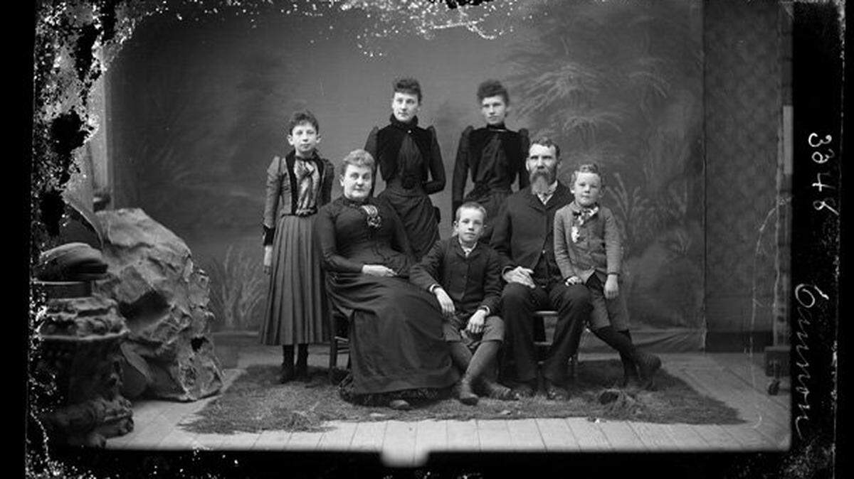 This image shows a glass plate negative of a 19th century portrait of the Cannon family by San Luis Obispo photographer R.J. Arnold.