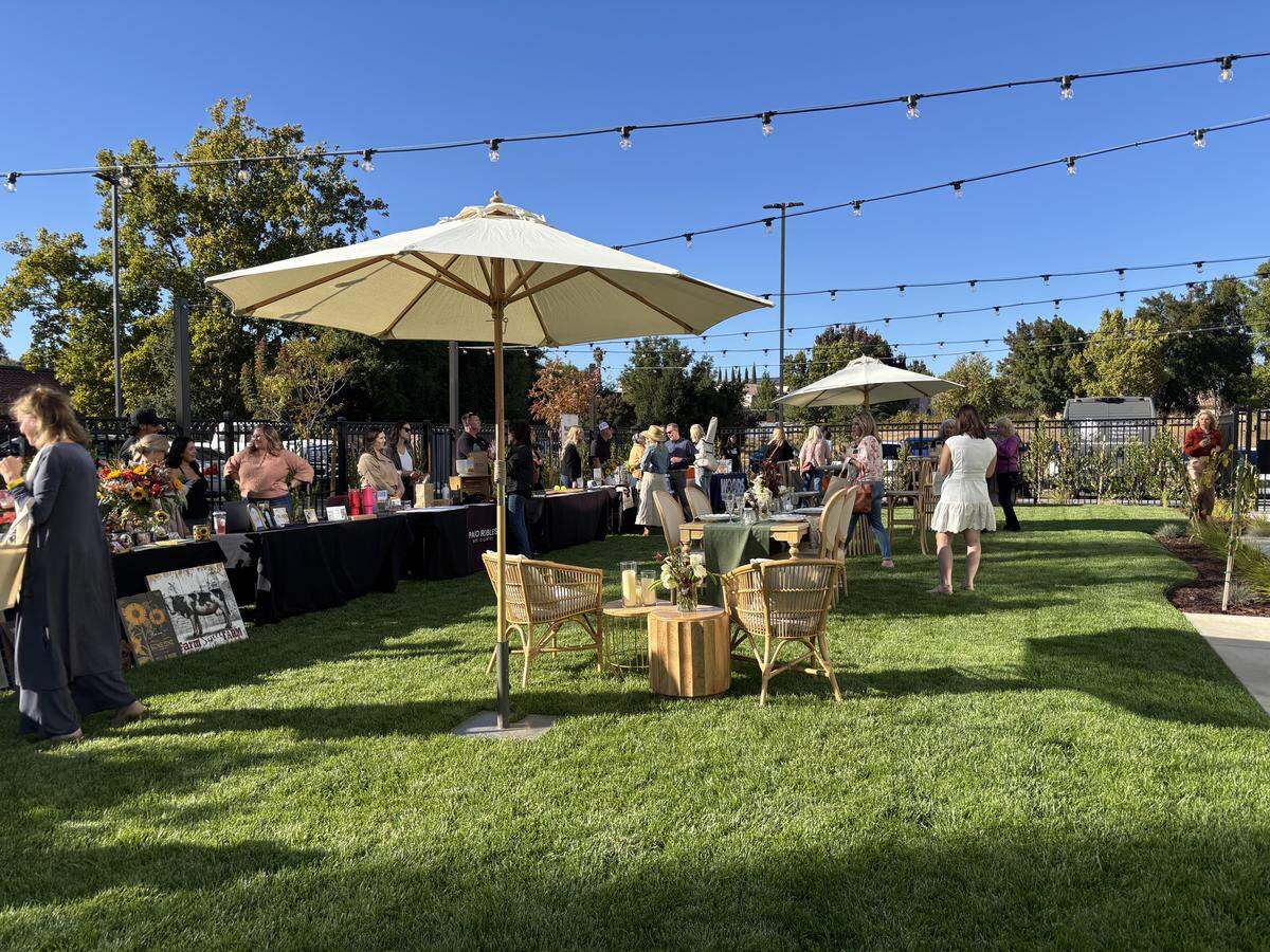 The Cambria Hotel Templeton-Paso Robles offers outdoor seating under string lights in its backyard.
