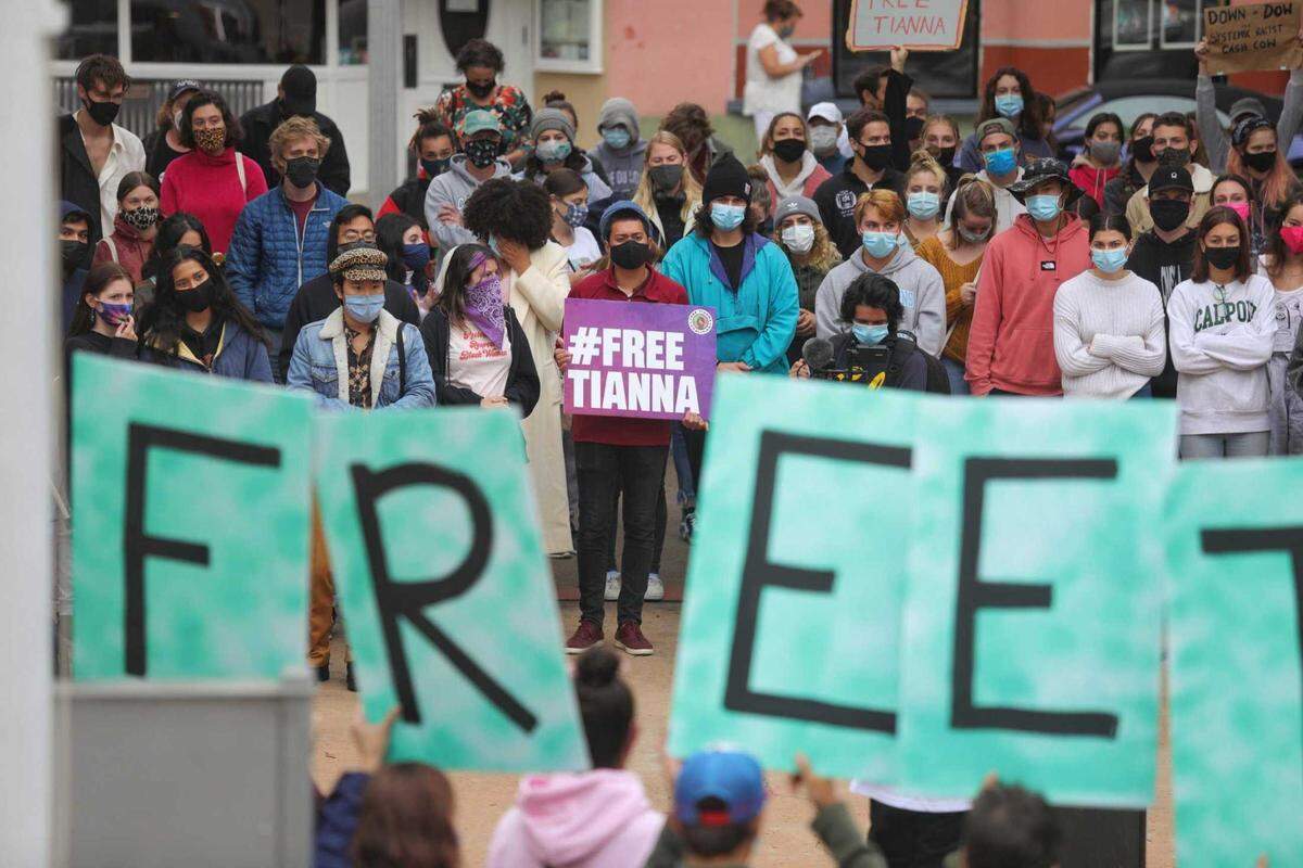 The crowd outside of the San Luis Obispo courthouse held “Free Tianna” placards Thursday as people gave speeches near the courthouse steps.