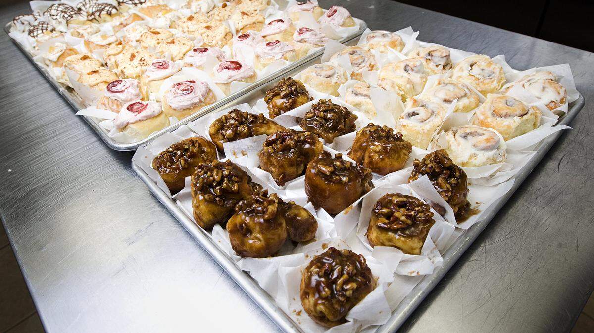 Trays of assorted mini cinnamon rolls are ready for sale at Emily’s Cinnamon Rolls in San Luis Obispo.