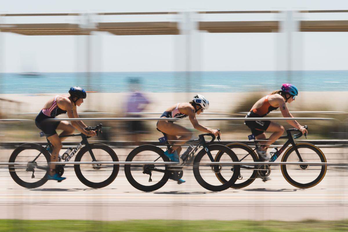 Cal Poly swimming alumna Taylor Spivey, center, is set for the world’s biggest athletic stage, as she will represent the U.S. at the 2024 Paris Olympics as a triathlete. The race is set for July 30, 2024.
