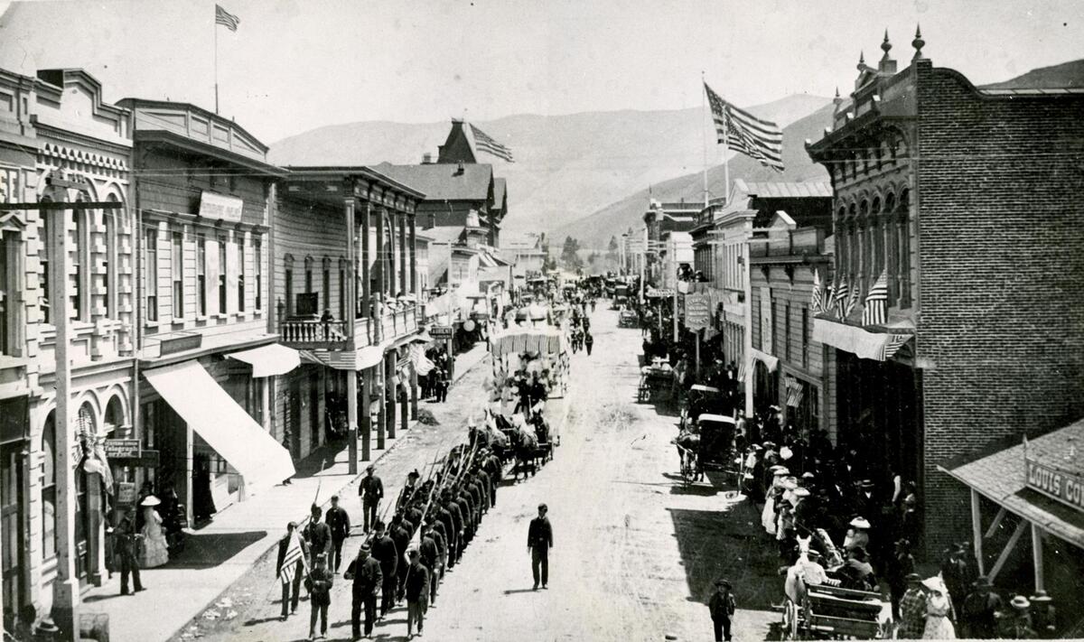 Monterey street was all decked out for the Fourth of July in this picture from 1885, as a military company swings down the street at the head of a long parade. The original Andrews Hotel appears at the corner of Monterey and Osos. It was built in 1885 and burned down in April 1886 after only nine months of operation. The Sinsheimer store appears at the right, little changed from today. At the left edge of the picture are the letters “SE” from the sign over the “White House” store. Sauer’s bakery appears just beyond the Western Union telegraph office, which became the lobby of the Blackstone Hotel. Note the great white hats that adorn practically every woman in sight. The print the Tribune has on file was cut in half and digitally reassembled here with edited caption information to correct errors from the Centurama edition that ran on May 9, 1956.