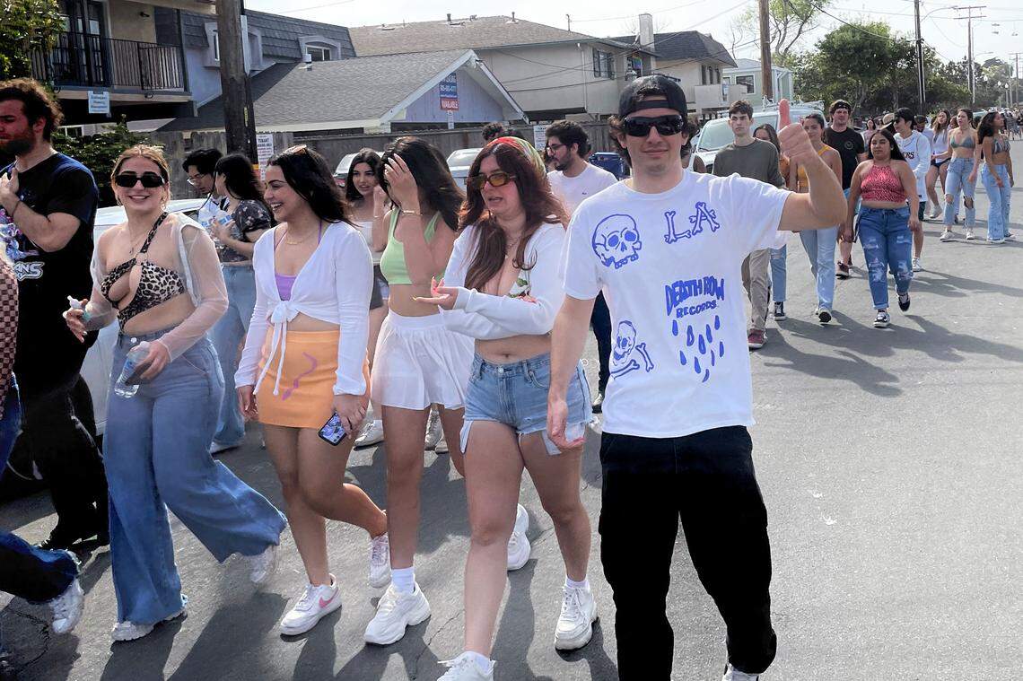 The annual unsanctioned street party known as Deltopia draws crowds of college students to Del Playa Drive in Isla Vista on Saturday.