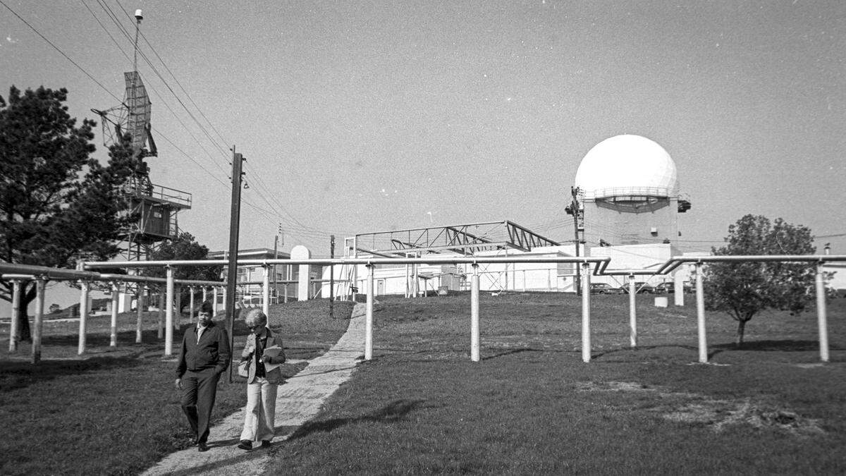 Training officer Jim Price, left, and Priscilla Comen, chat after tour of radar equipment housed in a massive concrete building. Tour of the Air Force radar station in Cambria as operations were scheduled to wind down, seen here on Jan. 24, 1979.