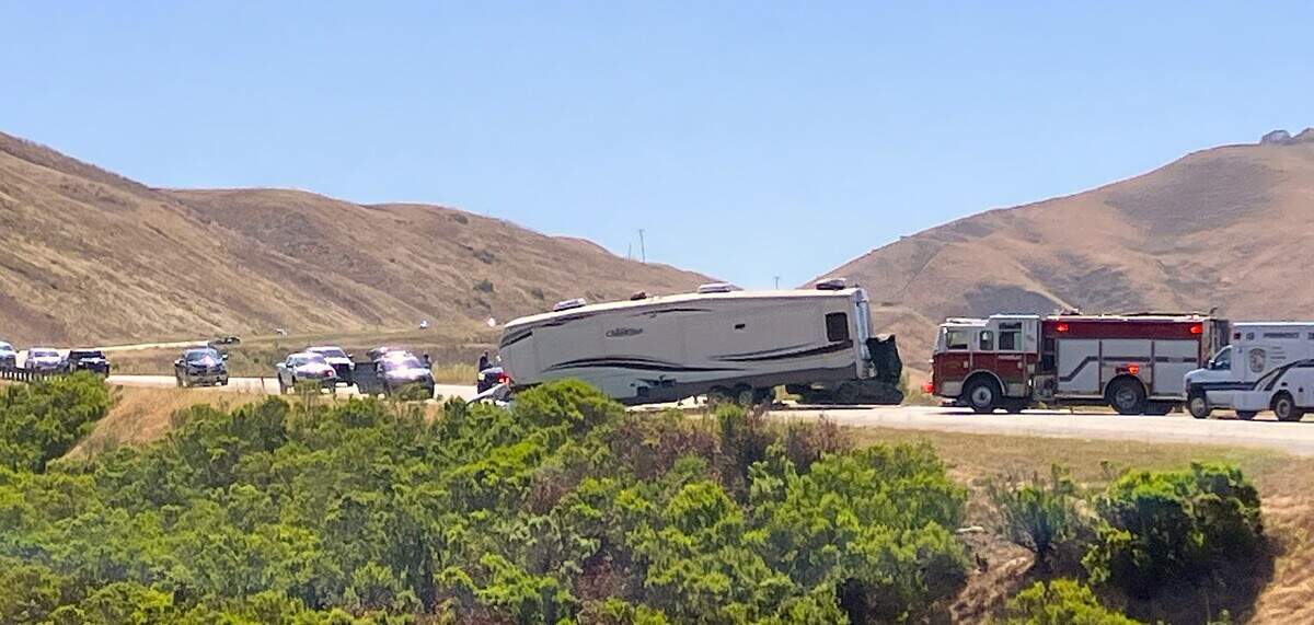 Emergency responders work at the scene of a head-on crash involving a pickup truck towing a fifth-wheel trailer and a Ford Mustang on Highway 46 west of Paso Robles on Sunday, June 7, 2026. The collision prompted a SigAlert and closure of the highway, according to CHP traffic logs.