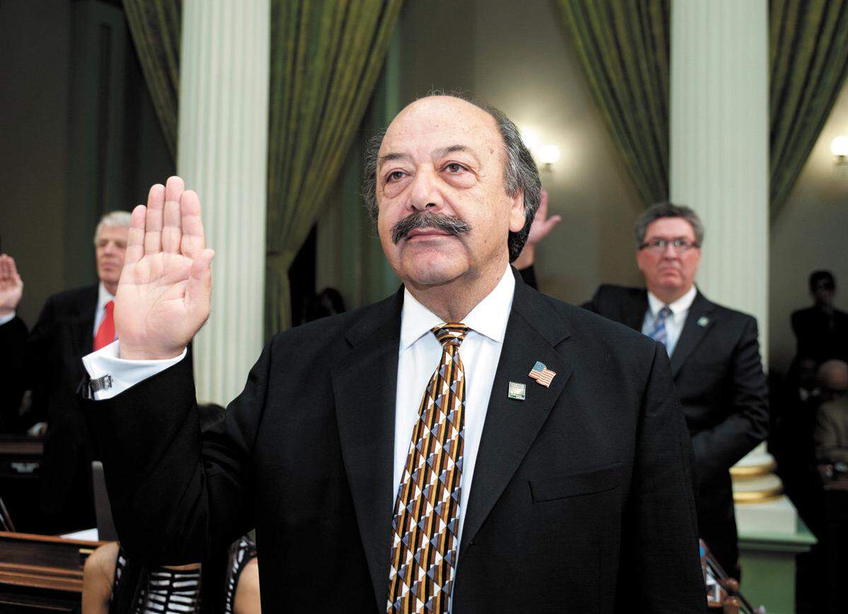 Assemblyman Katcho Achadjian, R-San Luis Obispo, takes the oath of office Monday, Dec. 3, 2012, in Sacramento.