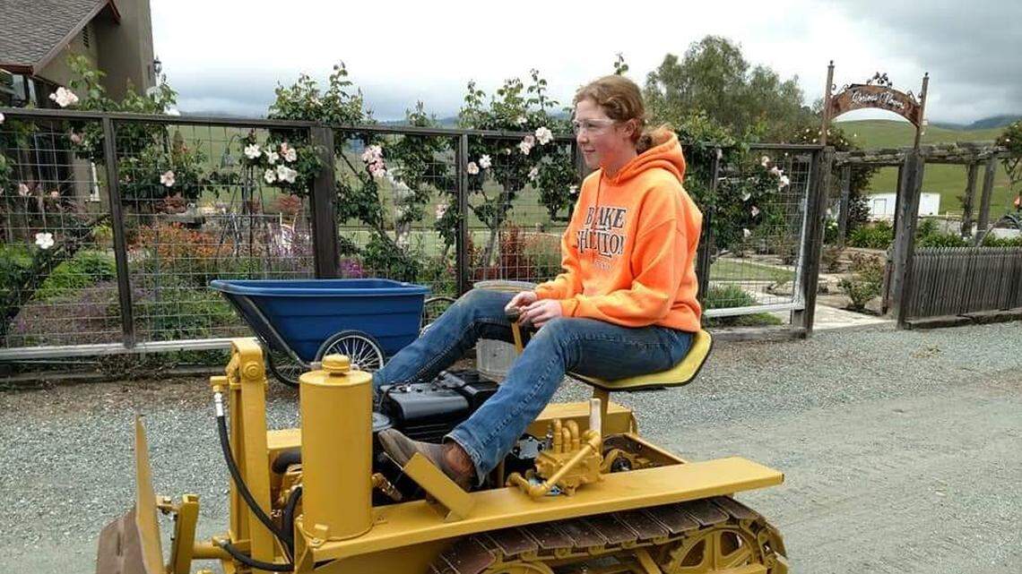 Templeton High School junior Mackay drives the 1950s-era Agricat dozer she rebuilt from a rusty stack of parts. It was her yearlong Maker Faire project for her engineering class.